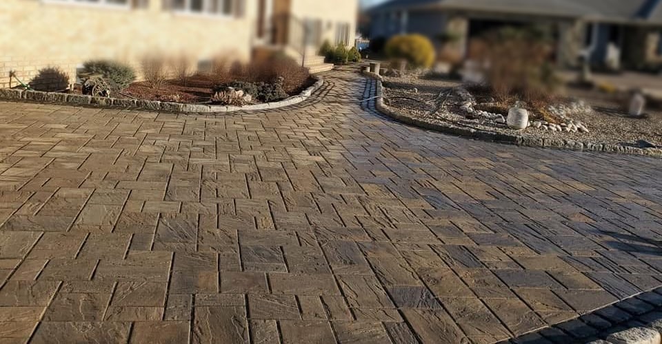 Decorative paving with a softly blurred residential background